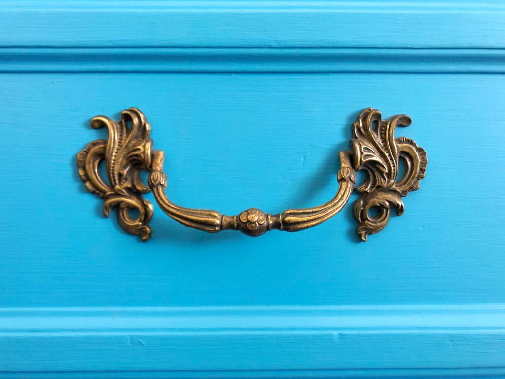 The original dresser hardware on the TV Stand